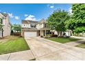 Attractive two-story home with an attached garage, manicured lawn, and inviting front entrance at 575 Marthas View Nw Dr, Huntersville, NC 28078