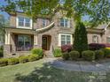 Inviting stone front exterior with manicured landscaping and a cozy front porch, enhancing curb appeal at 712 Chase Ct, Fort Mill, SC 29708