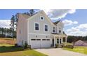 Charming two-story home with a two car garage, manicured lawn and lovely landscaping at 9913 Jack Nicklaus Dr # 908, Lancaster, SC 29720