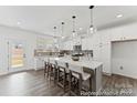 Spacious kitchen featuring a large island, modern appliances, and abundant natural light at 9913 Jack Nicklaus Dr # 908, Lancaster, SC 29720