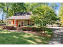 Charming home featuring beautiful landscaping and a welcoming front porch at 101 Blueberry Hill Dr, Statesville, NC 28625