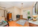 Entryway featuring hardwood floors and a white front door, with furniture and personal items adding a lived-in feel at 102 Forest Ct, Huntersville, NC 28078