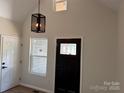Welcoming entryway featuring a black front door with glass accents and a modern light fixture at 122 39Th Avenue Nw Ct, Hickory, NC 28601