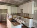 Bright kitchen features white cabinets and ample counter space awaiting finishing touches at 122 39Th Avenue Nw Ct, Hickory, NC 28601