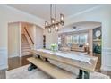 Open-concept dining area with views into the living room and staircase at 17231 Rider Wood Ln, Charlotte, NC 28278