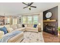 Cozy living room with a large sectional sofa, fireplace, and stylish decor at 17231 Rider Wood Ln, Charlotte, NC 28278