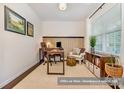 Bright home office with natural light, stylish desk, comfortable chair, and ample storage space at 17231 Rider Wood Ln, Charlotte, NC 28278