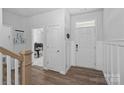 Bright entryway featuring wood-look floors and white wainscoting leading to additional rooms at 179 Bezelle Ave # 34, York, SC 29745