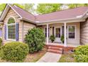 Inviting front porch with brick steps and elegant columns, creating a warm welcome at 2199 Lookout Pt, Rock Hill, SC 29732