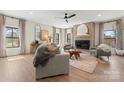 Bright living room features elegant decor, fireplace, and seamlessly connects indoor and outdoor spaces at 706 Falling Oak Aly # 16, Huntersville, NC 28078