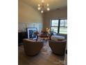 Stylish office space with modern furnishings, including a glass desk and comfortable seating at 706 Falling Oak Aly # 16, Huntersville, NC 28078