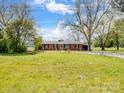 Brick ranch style home with mature trees in a quiet rural setting at 7516 Pageland Hwy # 3, Monroe, NC 28112