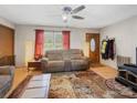 Cozy living room with hardwood floors and a wood burning stove at 7516 Pageland Hwy # 3, Monroe, NC 28112