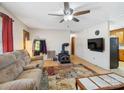 Inviting living room featuring a wood burning stove and mounted tv at 7516 Pageland Hwy # 3, Monroe, NC 28112