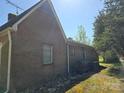 Brick home exterior with window and utility access on a sunny day at 8860 Castor Rd, Salisbury, NC 28146