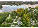 Stunning aerial view of a lakeside community with lush trees and beautiful homes at 1068 Grant Dr, Denver, NC 28037