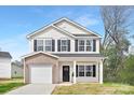 Charming two-story home with light siding, black shutters, and a cozy front porch at 1144 Thayer Glen Ct, Charlotte, NC 28213