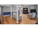 Inviting living room boasts natural light, hardwood floors, and a cozy fireplace at 1321 South Point Rd, Belmont, NC 28012