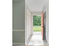 Sunlit entryway features tiled floors and a bright pink front door, flanked by coat closets at 1620 Matthews Dr, Rock Hill, SC 29732