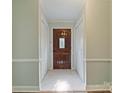 Inviting foyer features tiled floors, paneled walls and a gorgeous wood front door at 1620 Matthews Dr, Rock Hill, SC 29732