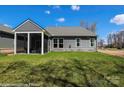 A lush green lawn with a screened porch area outside of a single-Gathering home at 2007 Mantle Ridge Dr # 192, Indian Trail, NC 28079