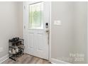 Entryway featuring the front door with decorative glass, with a shoe rack nearby at 209 Sheffield Dr, York, SC 29745