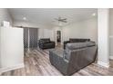 Open-concept living room with recessed lighting, ceiling fan, and modern gray furniture at 209 Sheffield Dr, York, SC 29745