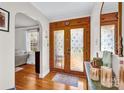 Inviting foyer with hardwood floors and decorative glass doors, creating an elegant and welcoming entrance at 218 N Bost St, Statesville, NC 28677