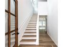 Bright foyer showcasing a staircase, luxury vinyl plank flooring and natural light at 6223 Rockwell W Blvd, Charlotte, NC 28269