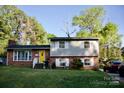 Lovely two-story home with brick accents and a vibrant yellow front door at 920 Squirrel Hill Rd, Charlotte, NC 28213