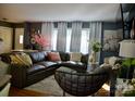 Cozy living room featuring a large leather sectional and stylish decor at 920 Squirrel Hill Rd, Charlotte, NC 28213