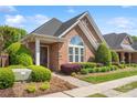 Beautiful brick home featuring well-maintained landscaping and a welcoming entrance at 962 Blakeley Walk, Rock Hill, SC 29732