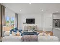 Inviting living room features modern furnishings, recessed lighting, and a neutral color palette at 10033 Guardian Dr # 265, Charlotte, NC 28273