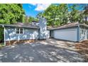 Charming home exterior featuring a well-maintained lawn, attached garage, and inviting curb appeal at 11914 Rock Canyon Dr, Charlotte, NC 28226