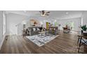 Open-concept living room featuring hardwood floors and seamless flow into the modern kitchen and dining area at 130B Springway Dr, Kannapolis, NC 28081