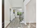 Bright foyer with gray wood-look flooring leads to a spacious living area at 1409 Bloomsberry Ln, Waxhaw, NC 28173