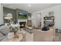 Comfortable living room features a fireplace, television, and modern decor at 1419 5Th Street Ne Dr, Hickory, NC 28601