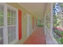 Spacious front porch showing red flooring, white railings, and a peaceful outdoor space at 1537 Haupt Strasse None, Conover, NC 28613