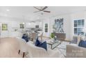 Inviting living space with a large window, white walls, and an open kitchen area at 1615 Martin Ave, Gastonia, NC 28052