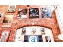 A brick wall adorned with music-themed artwork creates a vibrant atmosphere at 201 S Hoskins Rd # 132, Charlotte, NC 28208