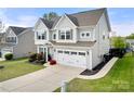 Beautiful two-story home with a two-car garage, a well-maintained lawn, and a classic design at 2262 Galloway Sw Ln, Concord, NC 28025