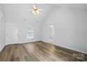 Bright living room featuring wood floors, neutral walls, vaulted ceiling, and natural light at 2290 Kestrel Dr, Rock Hill, SC 29732