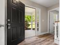 Inviting foyer featuring hardwood floors and a view of the front porch through the open door at 3002 Fair Meadows Dr, Monroe, NC 28110