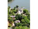 Aerial view of a waterfront property nestled among lush greenery on the shores of a serene lake at 364 Stone Cliff Ln, Clover, SC 29710