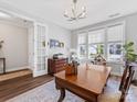 Bright office with hardwood floors, large windows, and classic wood furniture at 4012 Moxie Way, Charlotte, NC 28215