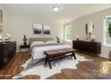 Stylishly staged bedroom with hardwood floors, a cozy bed, and contemporary decor for relaxation at 4203 Ethel Sustar Dr, Monroe, NC 28110