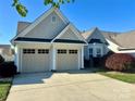 Charming home featuring a two-car garage and manicured front yard, offering great curb appeal at 536 Wellbourne Nw Ct, Concord, NC 28027
