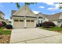 Charming home featuring a two-car garage, manicured lawn, and beautiful landscaping at 536 Wellbourne Nw Ct, Concord, NC 28027
