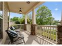 Relaxing front porch featuring comfortable seating and scenic neighborhood views at 541 Nw Sutro Forest Dr, Concord, NC 28027