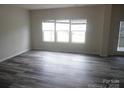 Sunlit living room with new flooring and neutral colors, perfect for relaxation at 574 30Th Avenue Ne Cir, Hickory, NC 28601